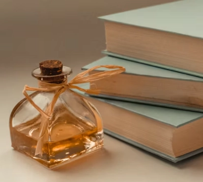 perfume next to the books
