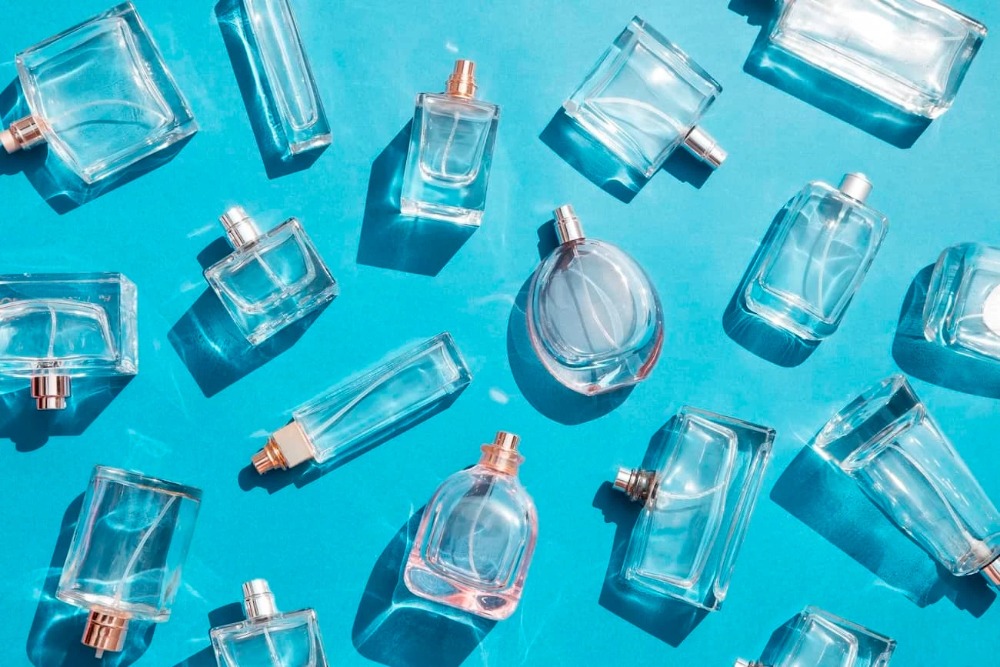 some perfumes against a blue background