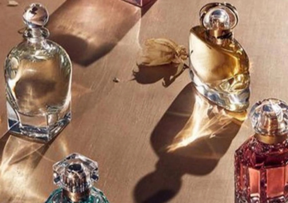 several bottles of colorful perfume